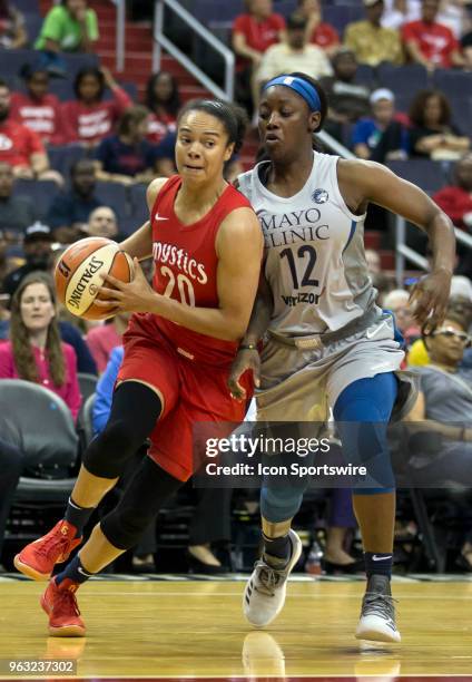 Washington Mystics guard Kristi Toliver pushes past Minnesota Lynx guard Alexis Jones during a WNBA game between the Washington Mystics and the...