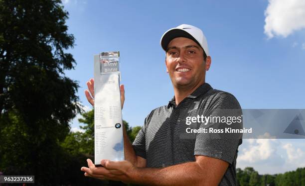 Francesco Molinari of Italy with the winners trophy on the 18th green after the final round of the BMW PGA Championship at Wentworth on May 27, 2018...