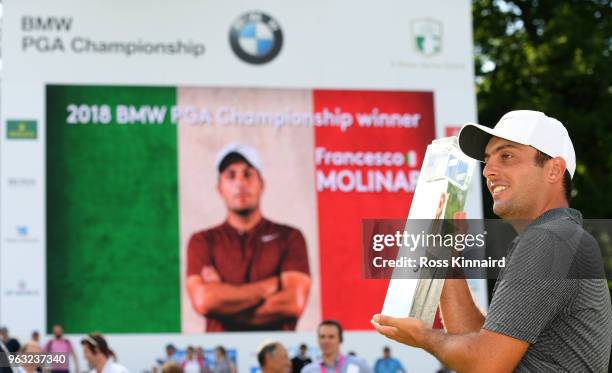 Francesco Molinari of Italy with the winners trophy on the 18th green after the final round of the BMW PGA Championship at Wentworth on May 27, 2018...