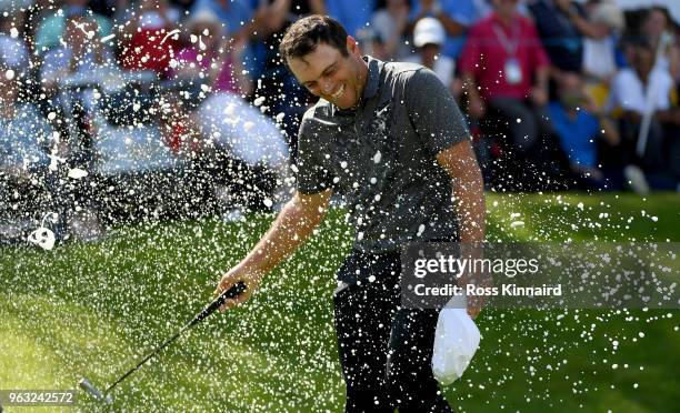 Francesco Molinari of Italy is sprayed with champagne after victory in the final round of the BMW PGA Championship at Wentworth on May 27, 2018 in...