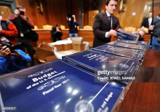 Staff member unpacks copies of US President Obama's FY2011 Budget at the Dirksen Senate Office Building in Washington, DC, on February 1, 2010....