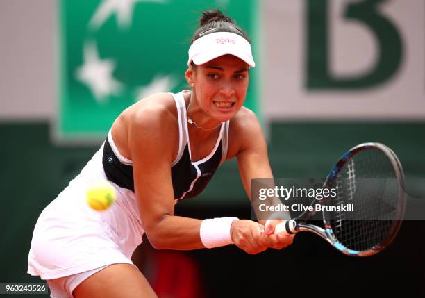 Veronica Cepede Royg of Paraguay plays a backhand during the ladies singles first round match aganist Petra Kvitova of Czech Republic during day two...