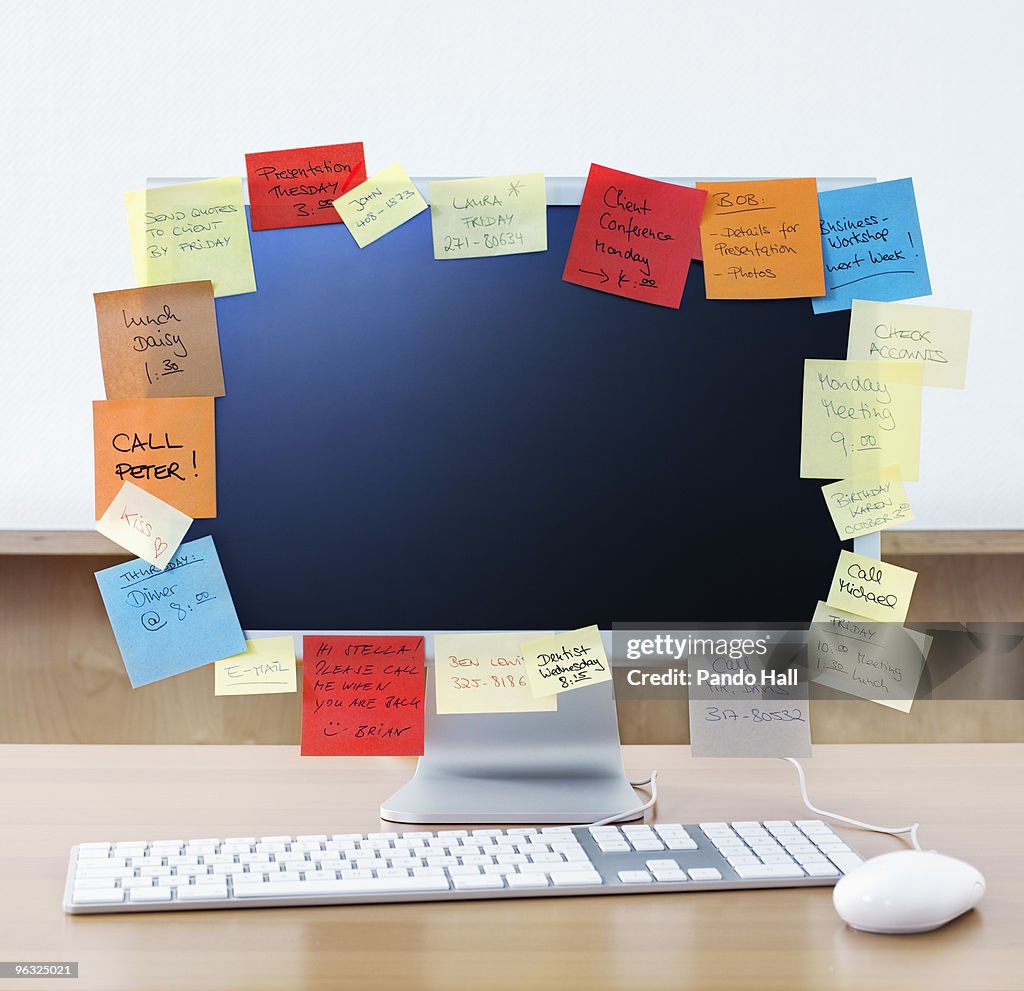 Computer Red Notes Multicoloured Adhesive Notes Surrounding Computer High-Res Stock Photo ...