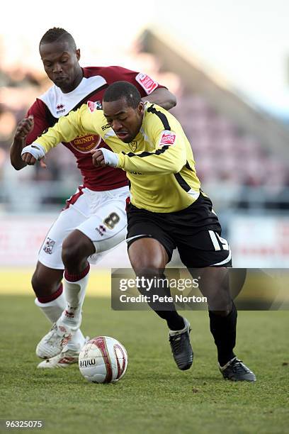 Jacques Maghoma of Burton Albion attempts to move away from Abdul Osman of Northampton Town during the Coca Cola League Two Match between 30, 2010 in...