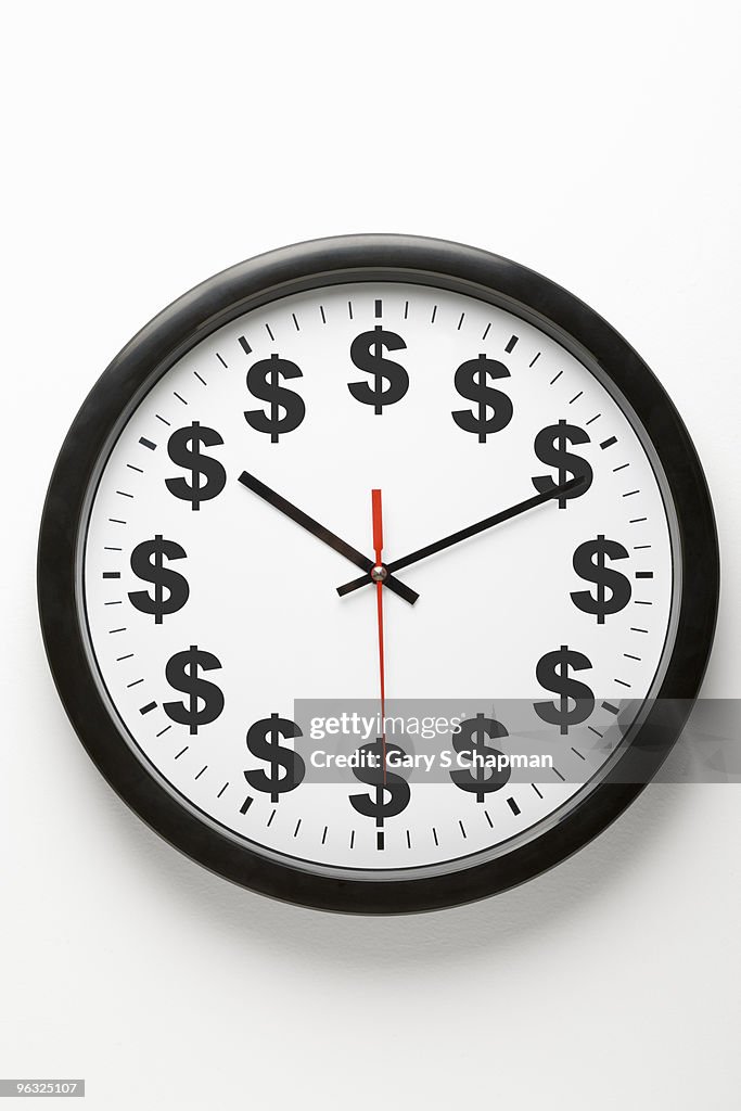 Clock on wall with dollar signs instead of number
