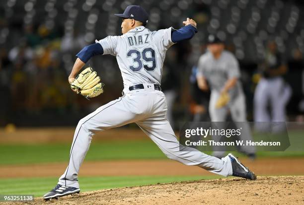 Edwin Diaz of the Seattle Mariners pitches against the Oakland Athletics in the bottom of the ninth inning at the Oakland Alameda Coliseum on May 23,...