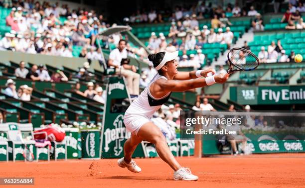 Veronica Cepede Royg of Paraguay plays a forehand during the ladies singles first round match aganist Petra Kvitova of Czech Republic during day two...