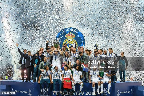 Real Madrid CF players ceebrates with the trophy following his side victory in the UEFA Champions League final between Real Madrid and Liverpool on...