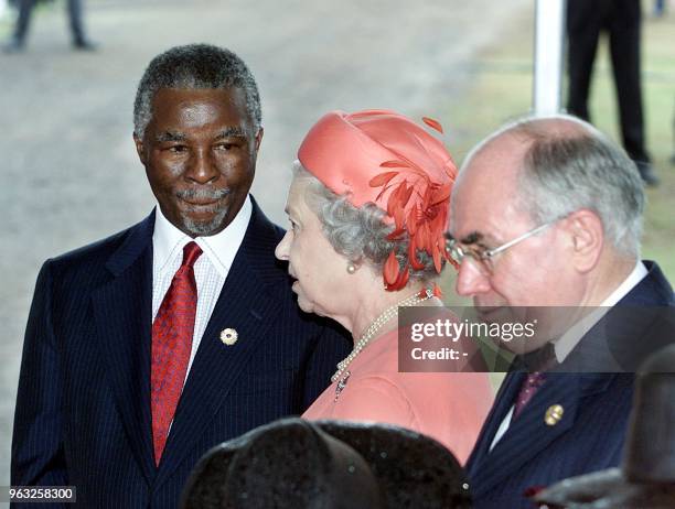 South African President Thabo Mbeki , Queen Elizabeth II and Australian Prime Minister John Howard arrive for the opening ceremony of the...