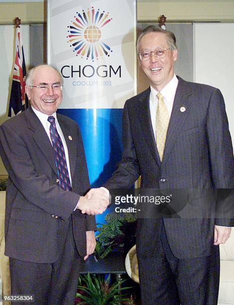 Australian Prime Minister John Howard shakes hands with his Singaporean counterpart Goh Chok Tong before the pair held bilateral talks During CHOGM...