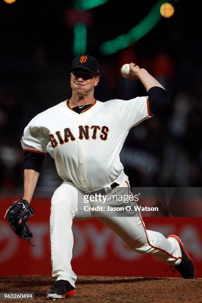 Tony Watson of the San Francisco Giants pitches against the Colorado Rockies during the tenth inning at AT&T Park on May 17, 2018 in San Francisco,...