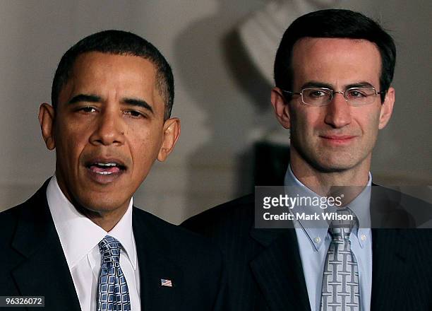 President Barack Obama speaks about his budget for fiscal year 2011 as White House budget director Peter Orszag looks on at the White House on...