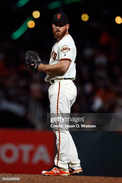 Sam Dyson of the San Francisco Giants stands on the pitchers mound against the Colorado Rockies during the eighth inning at AT&T Park on May 17, 2018...