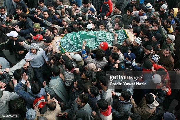 Kashmiri Muslims carry the dead body of a 14 years old teenager, Wamiq Farooq during his funeral on February 01, 2010 in Srinagar, India. At least 35...