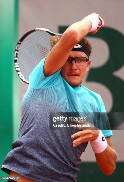 Denis Istomin of Uzbekistan plays a forehand during the mens singles first round match against Roberto Bautista Agut of Spain during day two of the...