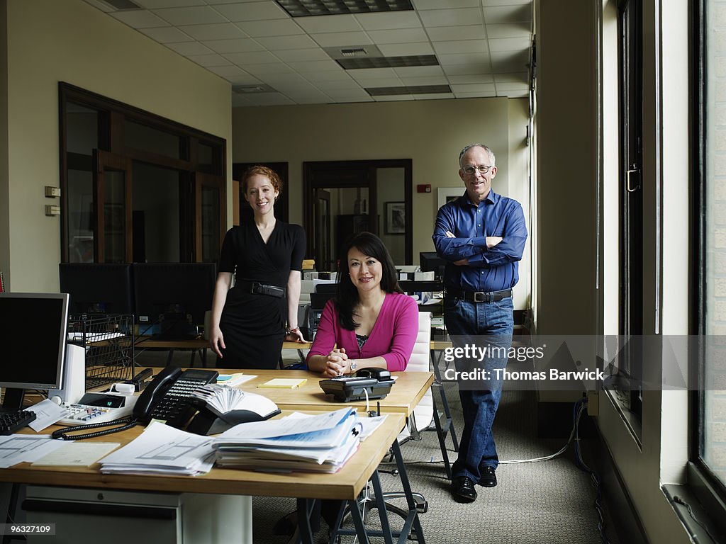 Three coworkers in office