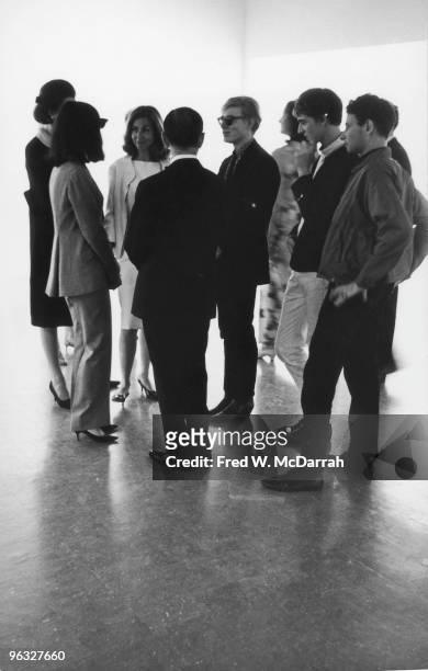 Group of men and women talk together at an opening in the Museum of Modern Art , New York, New York, June 5, 1965. Among those pictured are...