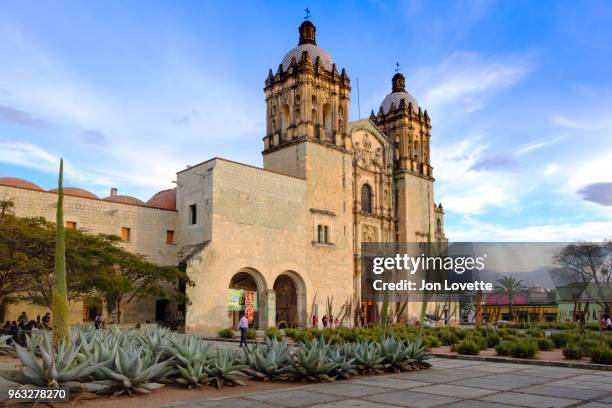 santo domingo church facade at dusk with plaza and garden - santo domingo church stock pictures, royalty-free photos & images