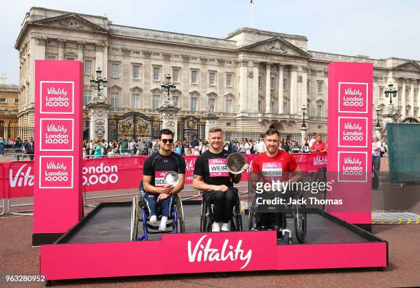 First place David Weir, second place Danny Sidbury and third place Michael Mccabe pose with their trophies during the Vitality London 10,000 on May...