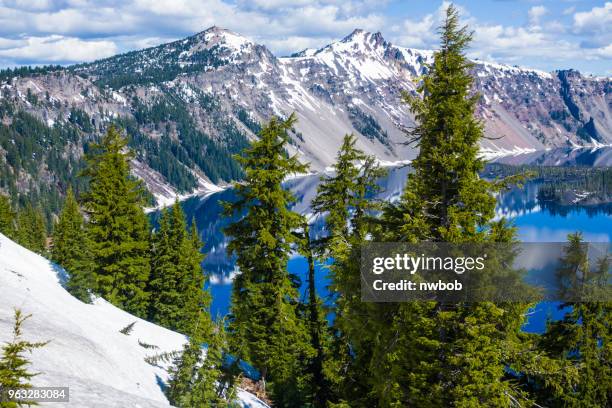 crater lake snow and reflections - wizard island stock pictures, royalty-free photos & images