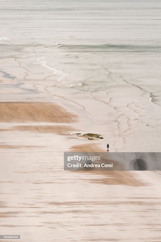 Person walks on a beach