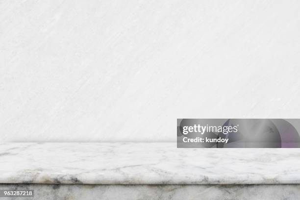 abstract background from empty white marble table top for showing product advertising with white concrete background. picture for add text message. backdrop for design art work. - marble photos et images de collection