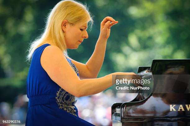 Joanna awrynowicz-Just is seen playing at one of the regular, free Chopin open air concerts in the Royal Baths park in Warsaw, Poland on May 27,...