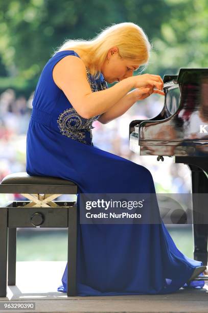 Joanna awrynowicz-Just is seen playing at one of the regular, free Chopin open air concerts in the Royal Baths park in Warsaw, Poland on May 27,...