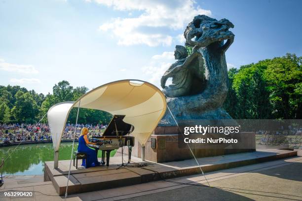 Joanna awrynowicz-Just is seen playing at one of the regular, free Chopin open air concerts in the Royal Baths park in Warsaw, Poland on May 27,...