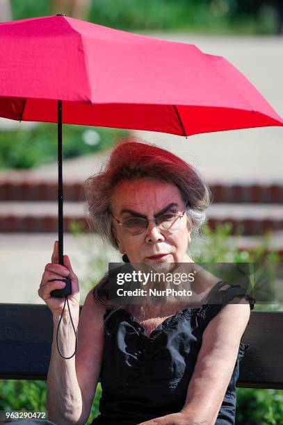 People are seen attending one of the regular, free Chopin open air concerts in the Royal Baths park in Warsaw, Poland on May 27, 2018. During the...