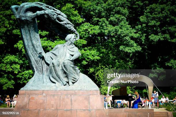 Joanna awrynowicz-Just is seen playing at one of the regular, free Chopin open air concerts in the Royal Baths park in Warsaw, Poland on May 27,...