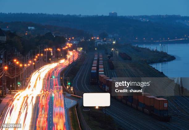 twilight traffic - train yard at night stock pictures, royalty-free photos & images