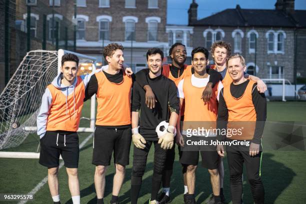 portrait of cheerful 7-aside football team - soccer team stock pictures, royalty-free photos & images