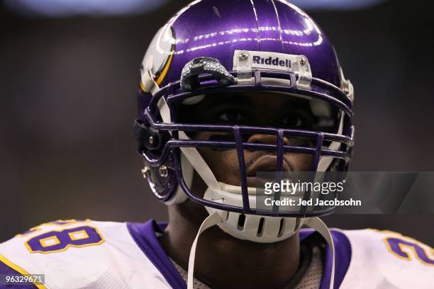 Adrian Peterson of the Minnesota Vikings looks on against the New Orleans Saints during the NFC Championship Game at the Louisiana Superdome on...