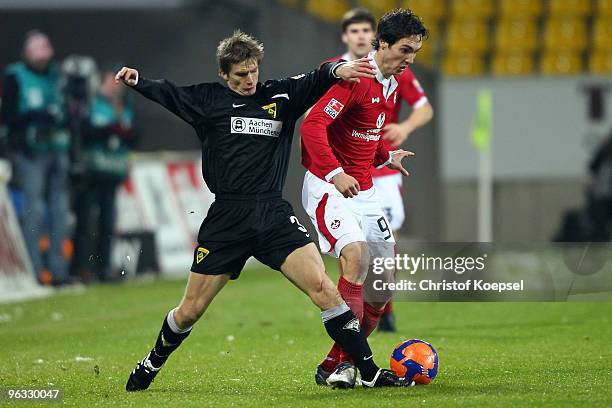 Allan Jepsen of Aachen tackles Srdjan Lakic of Kaiserslautern during the Second Bundesliga match between Alemannia Aachen and 1. FC Kaiserslautern at...