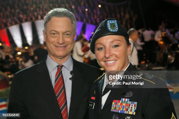 Co-host Gary Sinise and Silver Star recipient Leigh Ann Hester pose for photo during the finale of the 2018 National Memorial Day Concert at U.S....