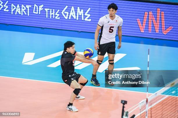 Satoshi Ide and Tatsuya Fukuzawa of Japan during the Nations League match between Iran and Japan at Kindarena Stadium on May 27, 2018 in Rouen,...