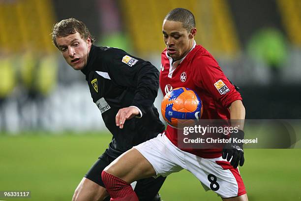 Daniel Adlung of Aachen tackles Sidney Sam of Kaiserslautern during the Second Bundesliga match between Alemannia Aachen and 1. FC Kaiserslautern at...