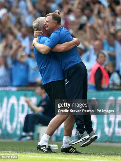 Coventry City manager Mark Robins celebrates with acting assistant manager Adi Viveash after Coventry City's Jack Grimmer scores his side's third...