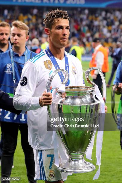 Cristiano Ronaldo of Real Madrid holds the trophy following the UEFA Champions League final between Real Madrid and Liverpool at the NSC Olimpiyskiy...