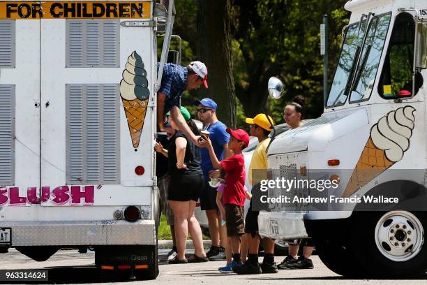 Young and old searched out a frosty treat from ice cream trucks parked near Ashbridges Bay Park.