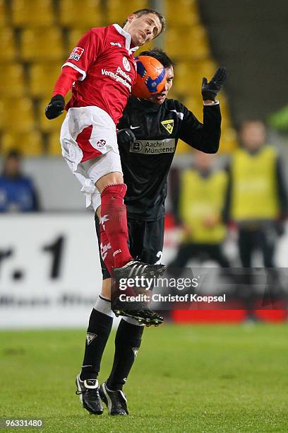 Ivo Ilicevic of Kaiserslautern and Mirko Casper of Aachen go up for a header during the Second Bundesliga match between Alemannia Aachen and 1. FC...