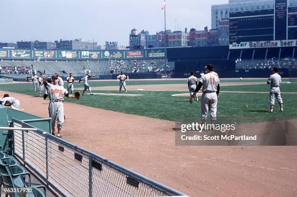 New York City - Baltimore Orioles baseball players warm up on the field before a game at Yankee Stadium.