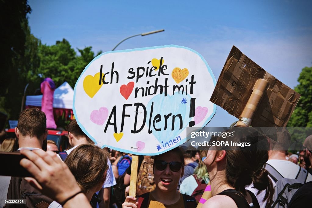 A woman seen holding a placard during the protest.
Techno...