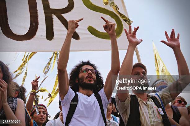 Demonstrators seen shouting slogans during the protest. Techno lovers and anti racism activists have marched in Berlin against a rally organised by...