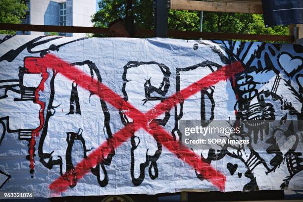 Banner with AFD crossed seen during the protest. Techno lovers and anti racism activists have marched in Berlin against a rally organised by the...