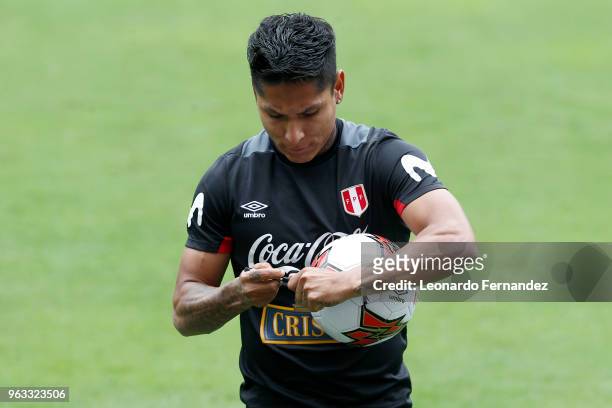 Raul Ruidiaz signs a ball for the fans during an open training session ahead of FIFA World Cup Russia 2018 on May 26, 2018 in Lima, Peru.