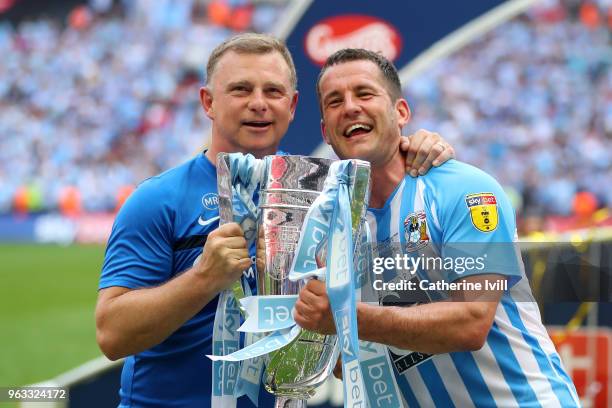 Mark Robins, Manager of Coventry City and Michael Doyle of Coventry City celebrate victory with the trophy after the Sky Bet League Two Play Off...