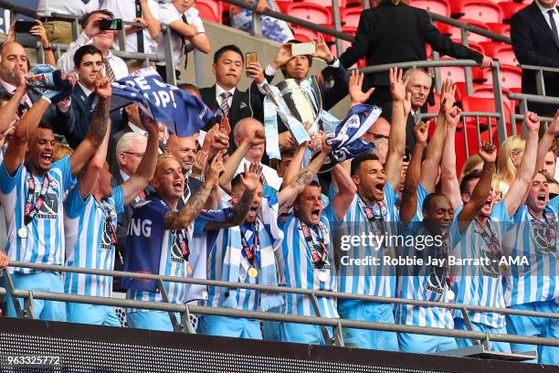 Michael Doyle of Coventry City lifts the EFL Sky Bet League Two play off final trophy with his team mates during the Sky Bet League Two Play Off...