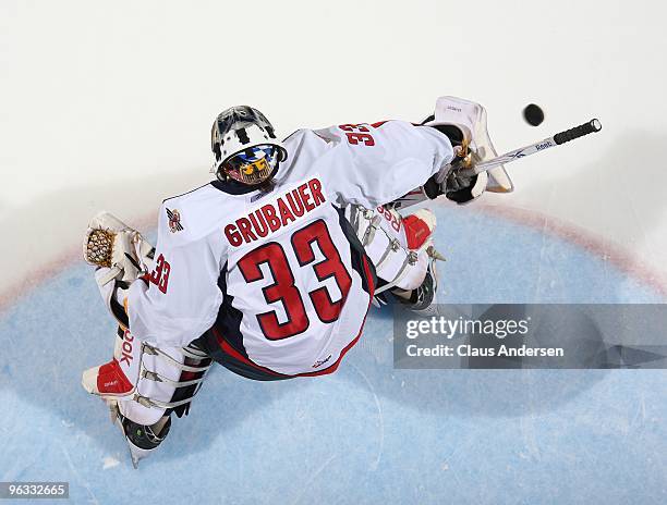 Philipp Grubauer of the Windsor Spitfires stops a shot in the warm-up prior to a game against the London Knights on January 29, 2010 at the John...